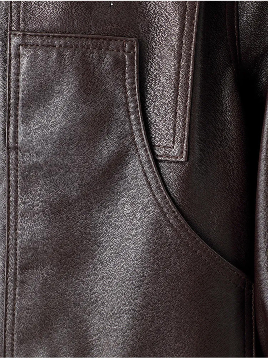 Close-up of the curved patch pocket and overlaid chest detail on the Rich Juniper sheepskin jacket — From Borcelleclothes.