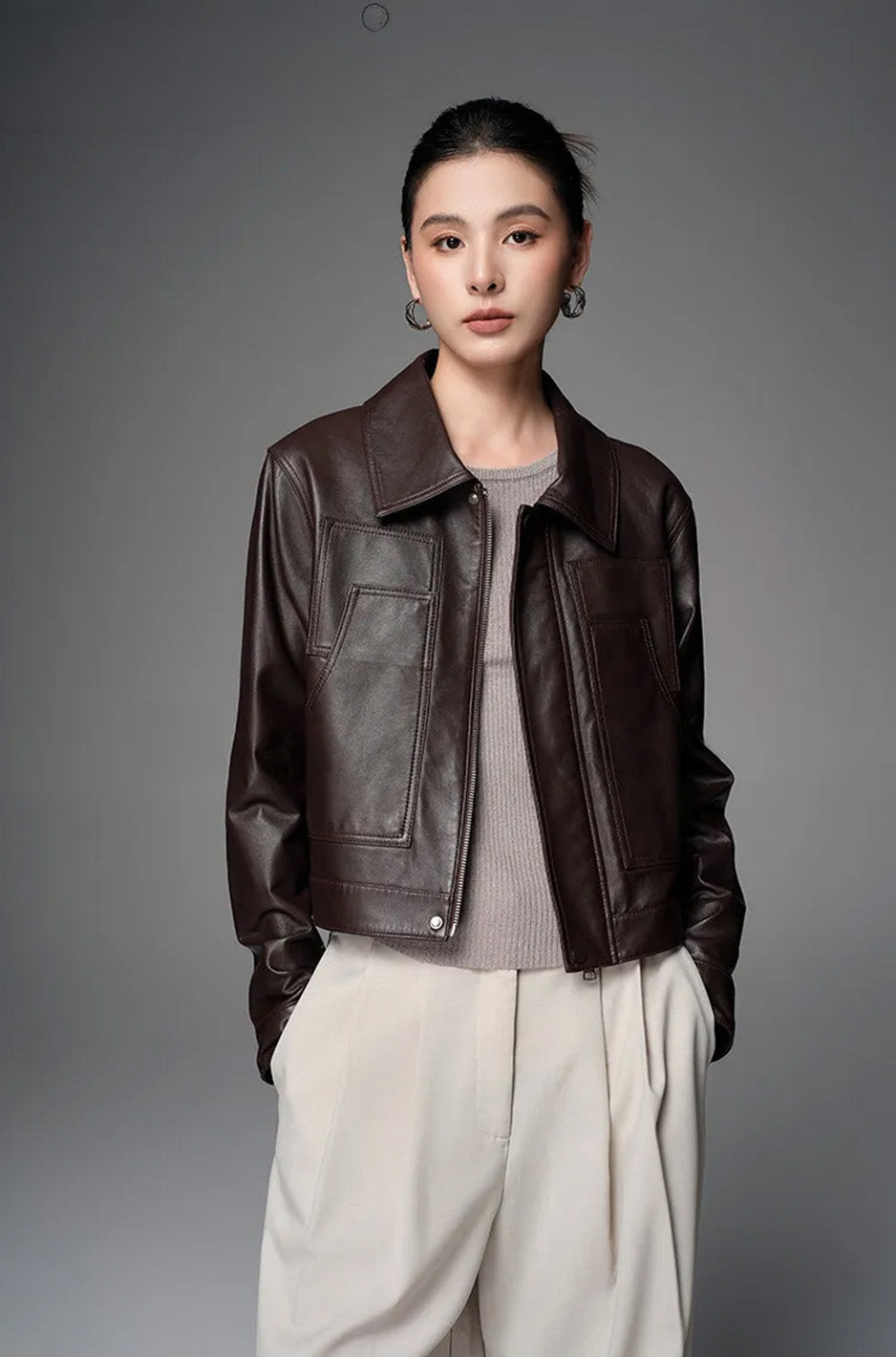 Model wearing the unzipped Rich Juniper sheepskin jacket, looking directly at the camera — From Borcelleclothes.