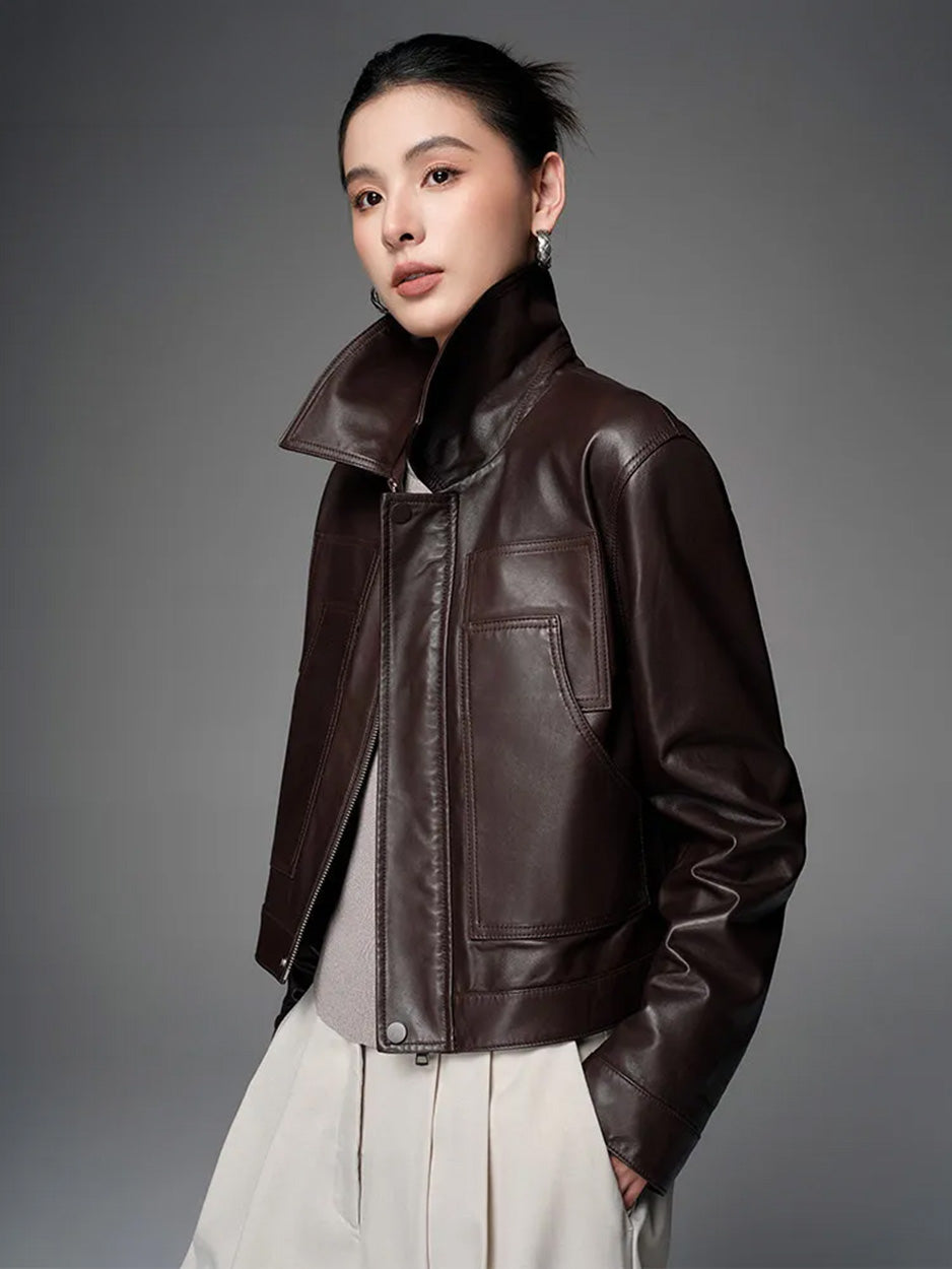 Women's Vegetable-tanned full-grain sheepskin jacket in Rich Juniper, with an uncoated, natural finish. Features a boxy cropped silhouette, sharp collar, and overlaid details. — From Borcelleclothes.