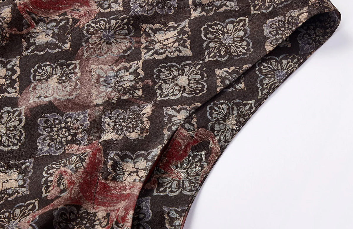 Detailed view of the clean, tailored armhole finish and structured silk drape — From Borcelleclothes.