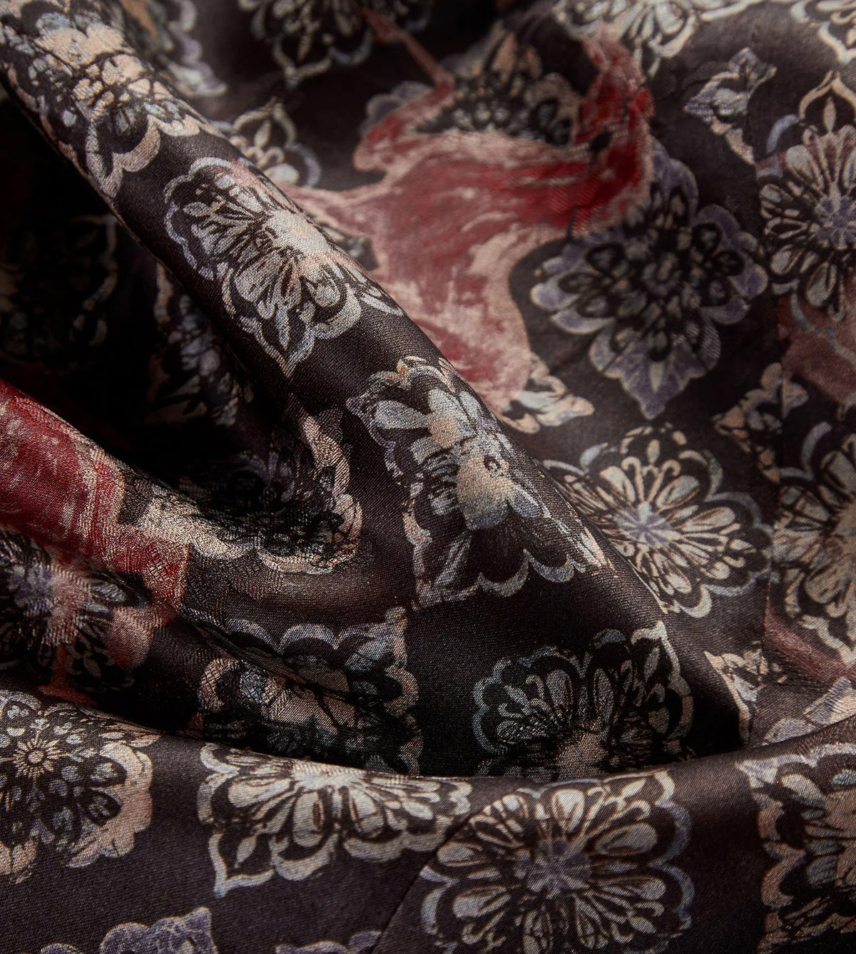 Close-up of the fluid, wave-folded texture showing the espresso face of Xiangyunsha silk — From Borcelleclothes.