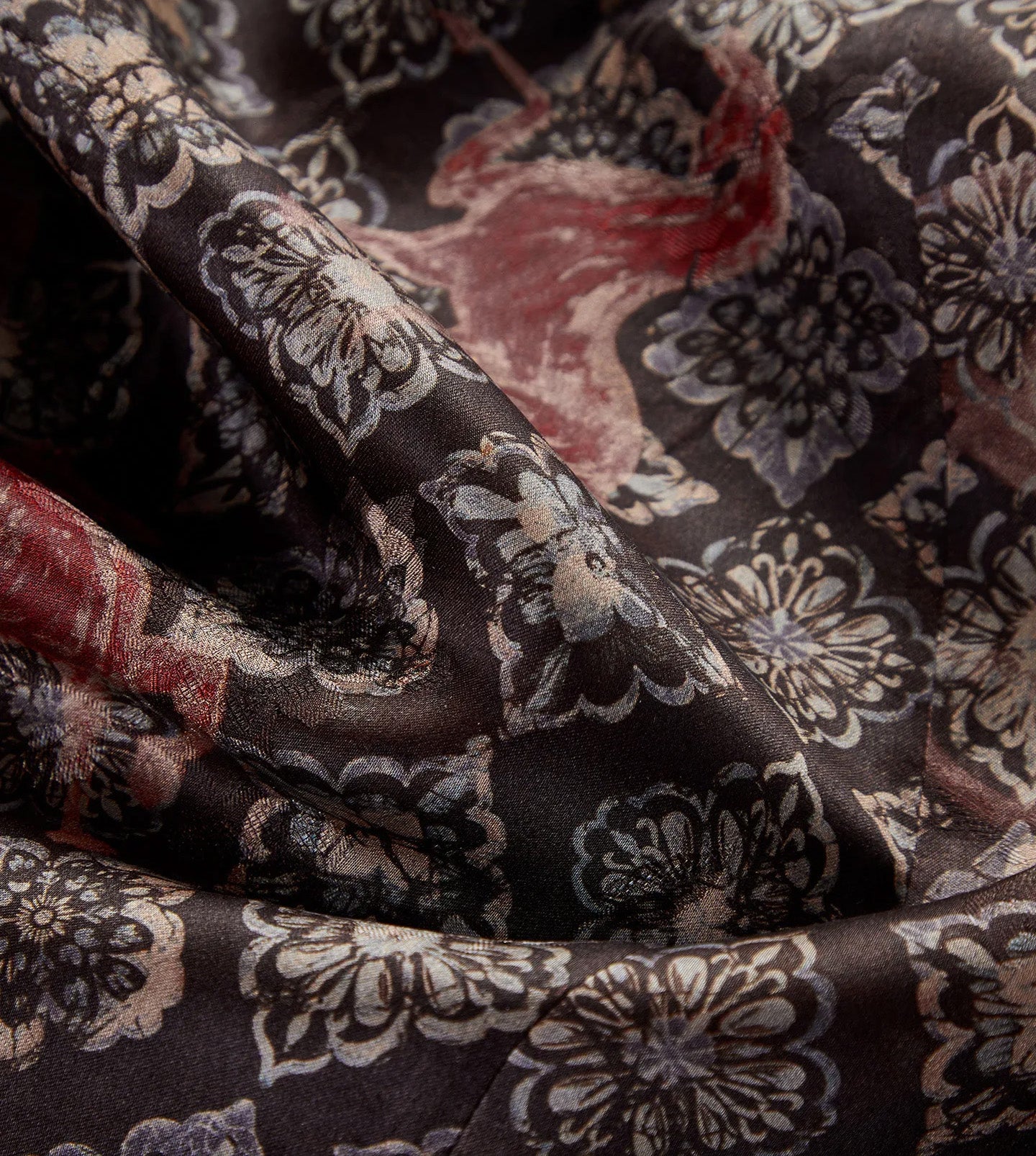 Close-up of the fluid, wave-folded texture showing the espresso face of Xiangyunsha silk — From Borcelleclothes.