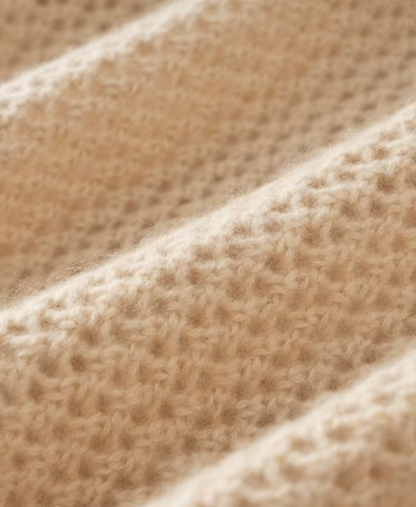 Close-up of wave-folded mesh texture and integrated floral motif in Brandy — From Borcelleclothes.