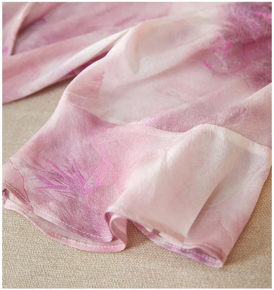 Close-up of the 1/2 sleeve featuring fluid flounce cuffs that move gracefully with every gesture — From Borcelleclothes.