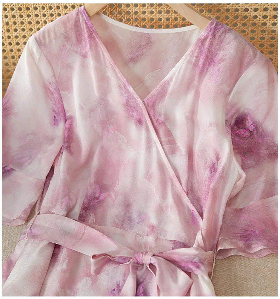 Detailed view of the upper section of the silk dress, showcasing the precise tailoring of the fixed wrap bodice — From Borcelleclothes.