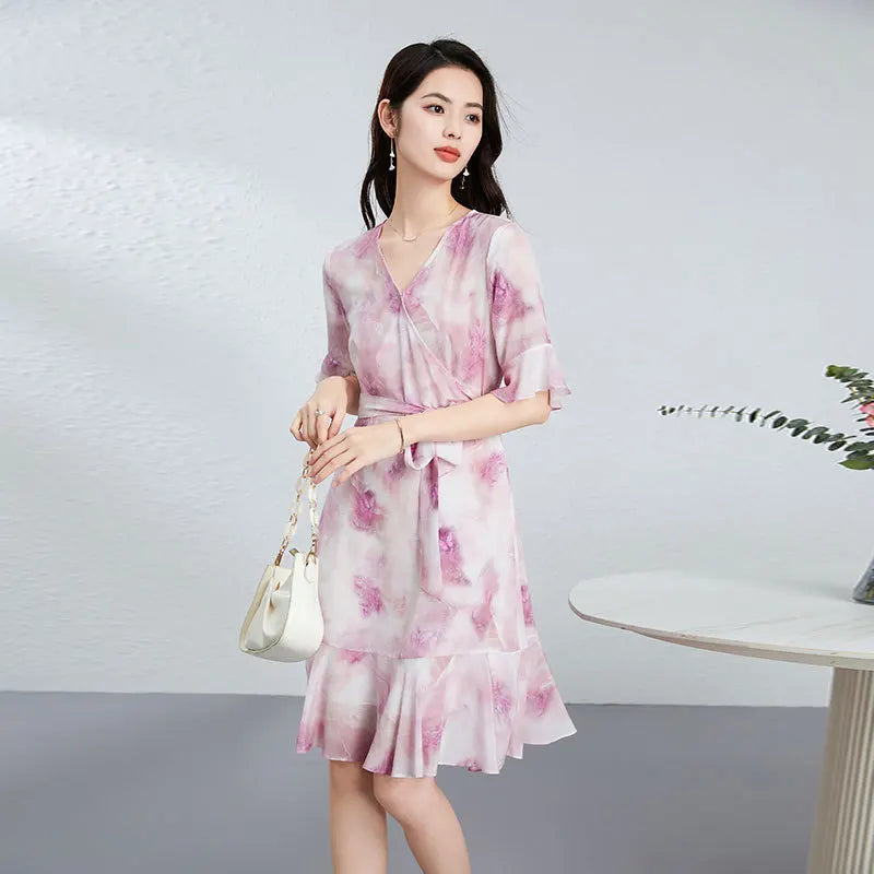 Women's Mid-calf flared wrap dress in 100% Mulberry silk crepe de Chine in Highland Heather. Features a wrap bodice, flounce cuff sleeves, and wave-curved flounces. — From Borcelleclothes.