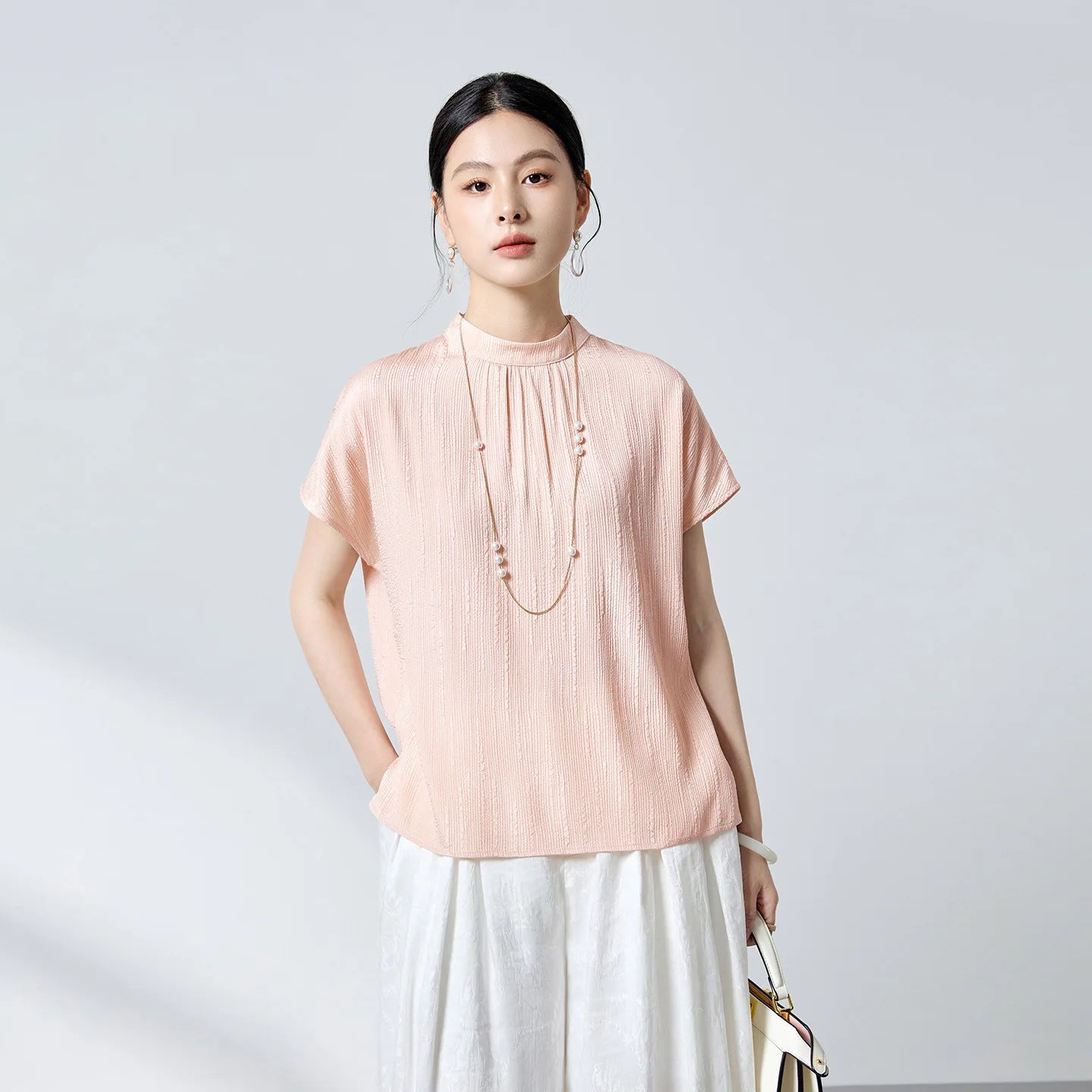 Women's 19 Momme stretch silk jacquard blouse in Falling Memories. Features fluted texture, delicate gathers beneath a stand collar, and short kimono sleeves. — From Borcelleclothes.