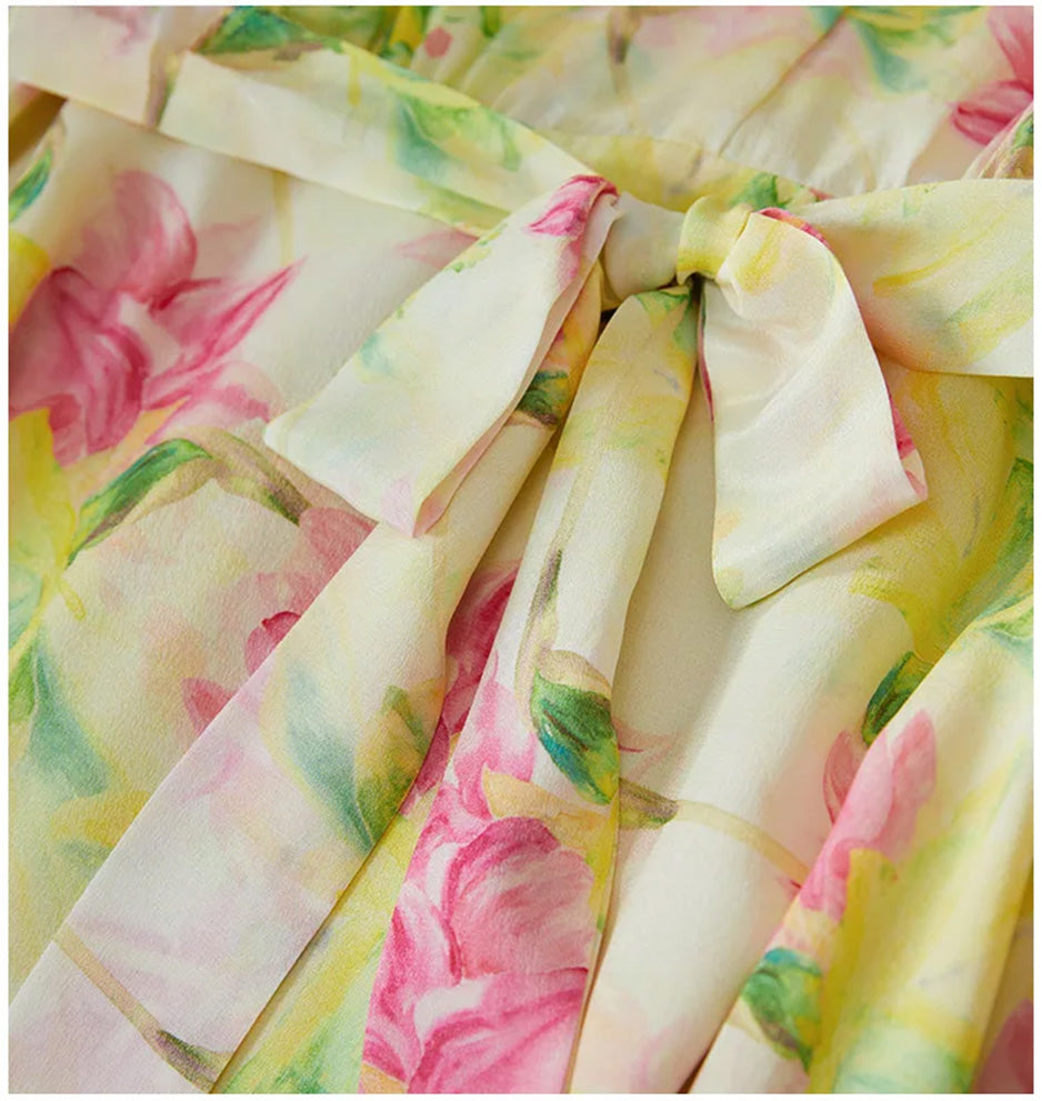 Close-up of the matching silk bow sash tied at the waist of the Magnolia in May silk midi dress — From Borcelleclothes.