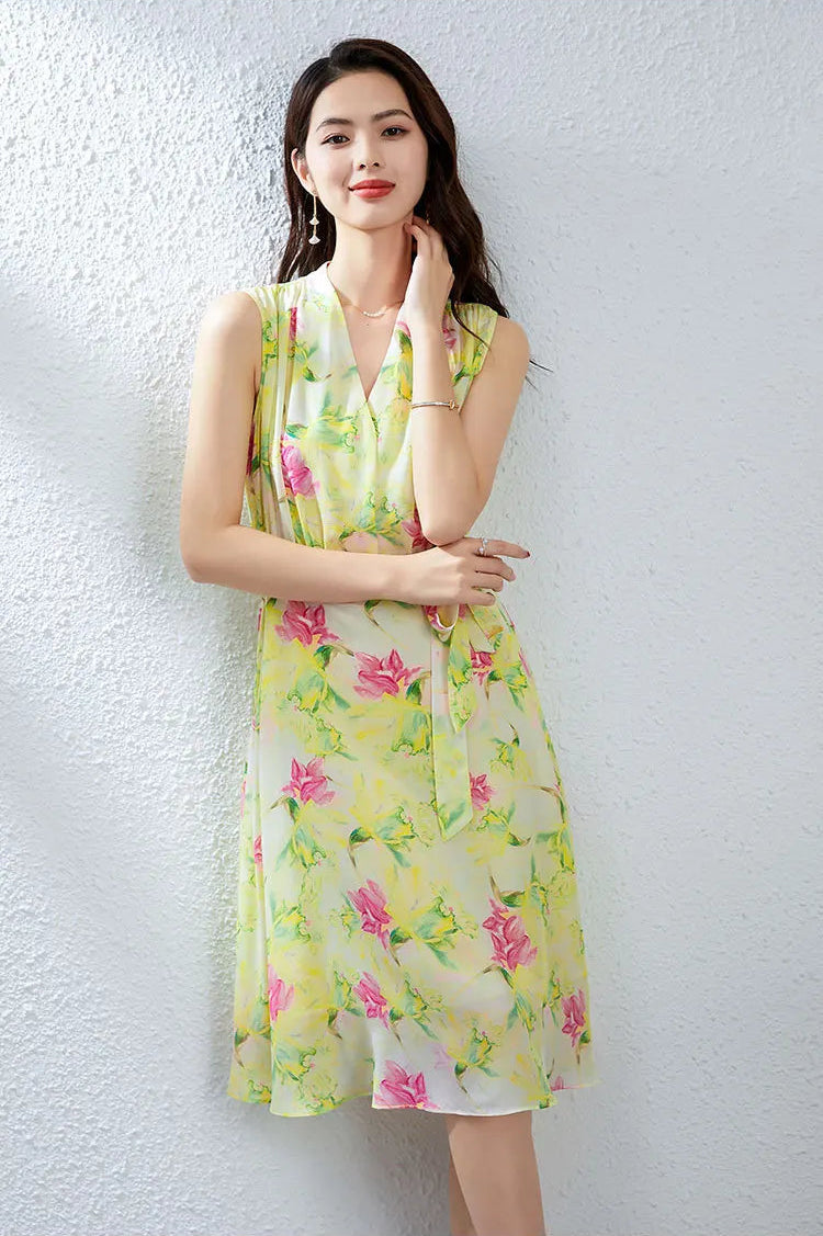 Close-up of a woman touching her neck, highlighting the structured framed collar of the Magnolia in May silk dress — From Borcelleclothes.