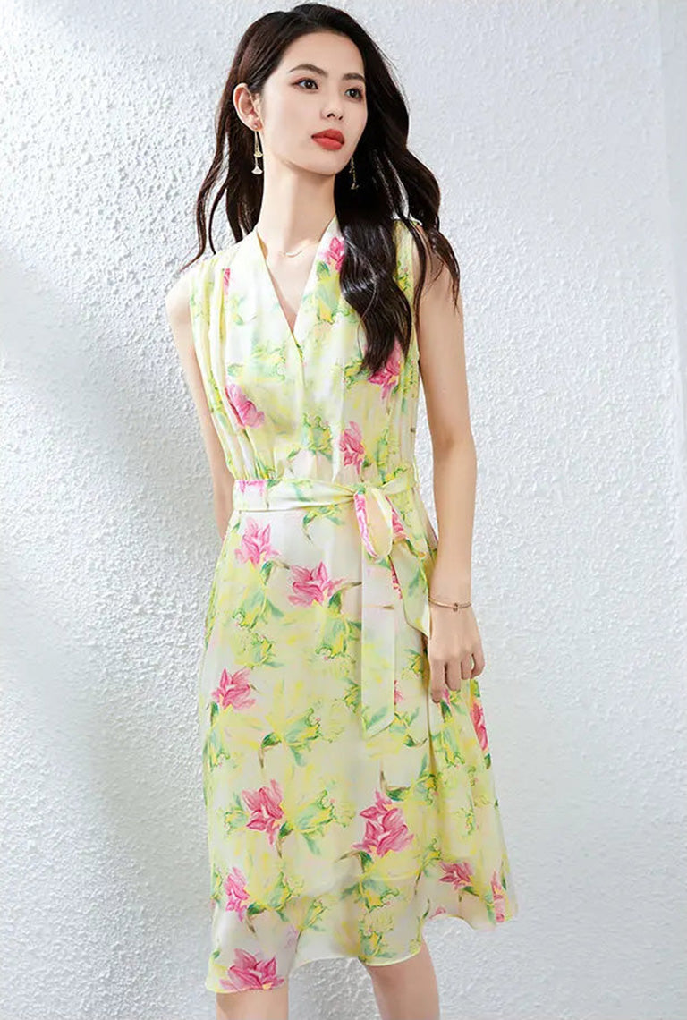 A woman turned slightly to the side in the Magnolia in May silk dress, emphasizing the fluid movement of the Mulberry silk Crepe de Chine — From Borcelleclothes.