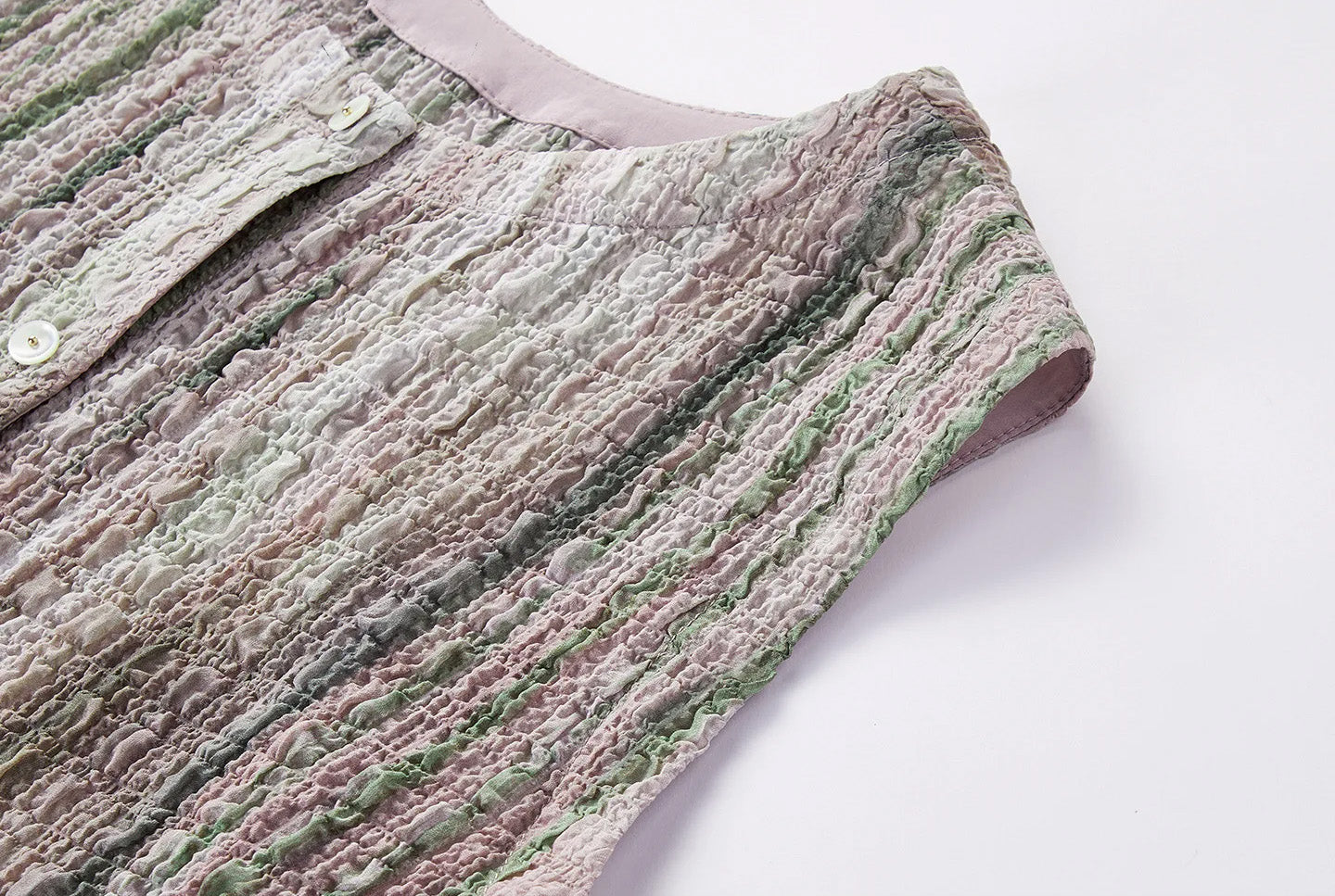 Detailed view of the tailored armhole construction on sleeveless silk 3D puckered blouse — From Borcelleclothes.