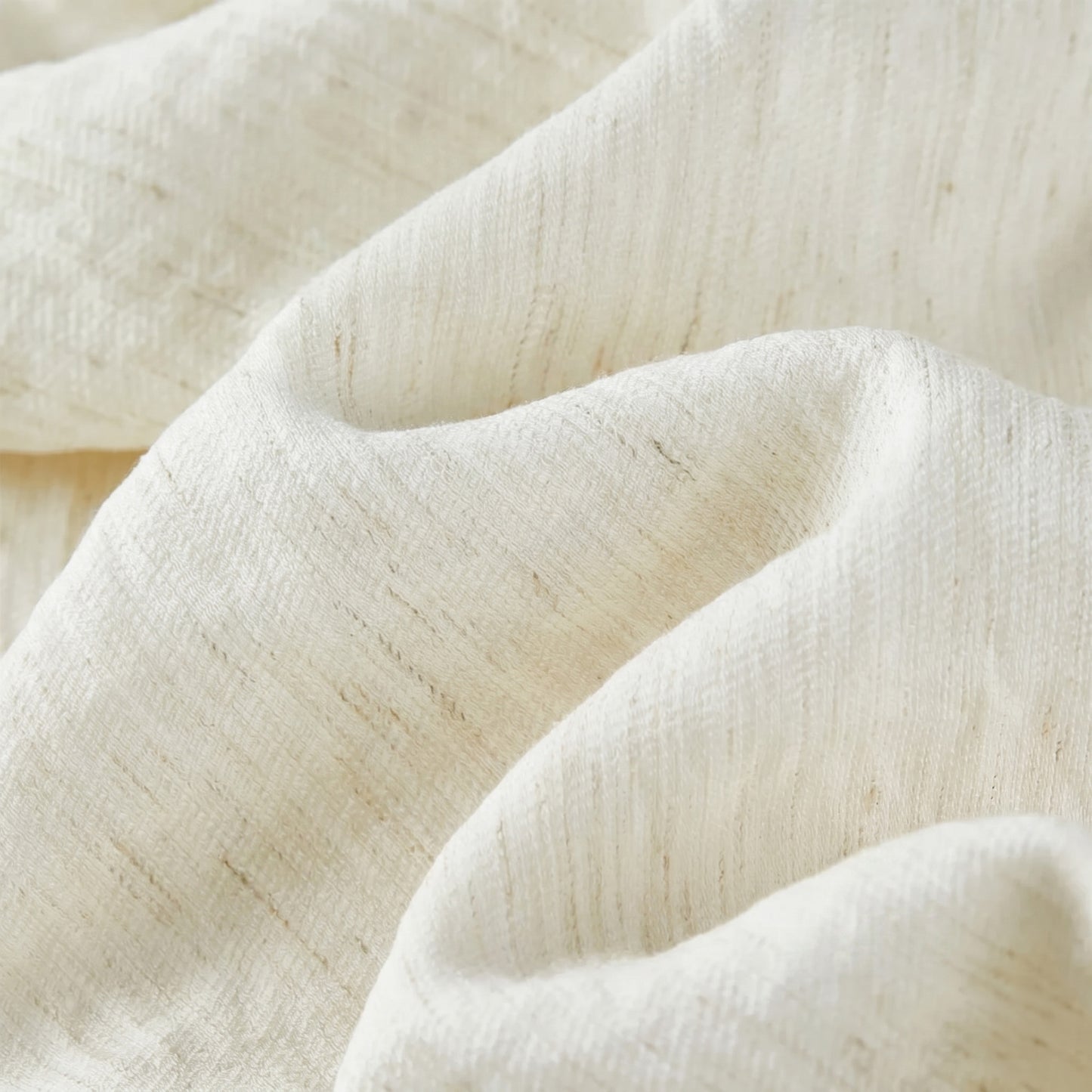 Close-up of the signature wave-folded crinkled texture in Ether de Marbre, showing the interplay of light on the fabric. — From Borcelleclothes.