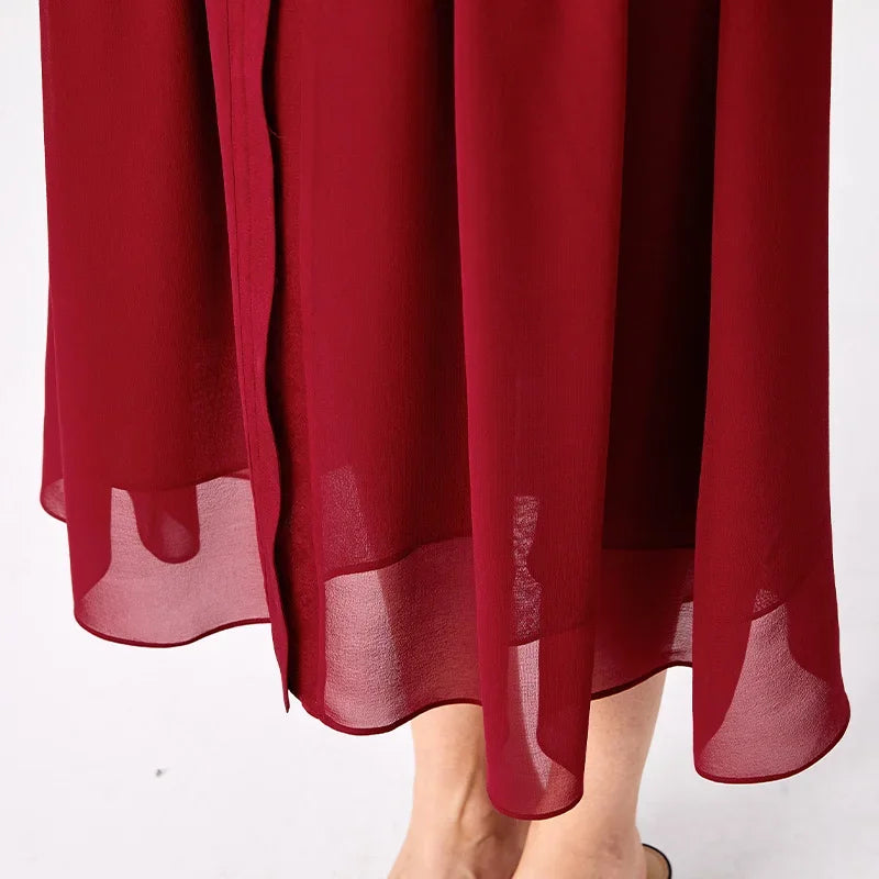 Close-up of the fluid georgette bottom hem and calf-length inner lining construction — From Borcelleclothes.
