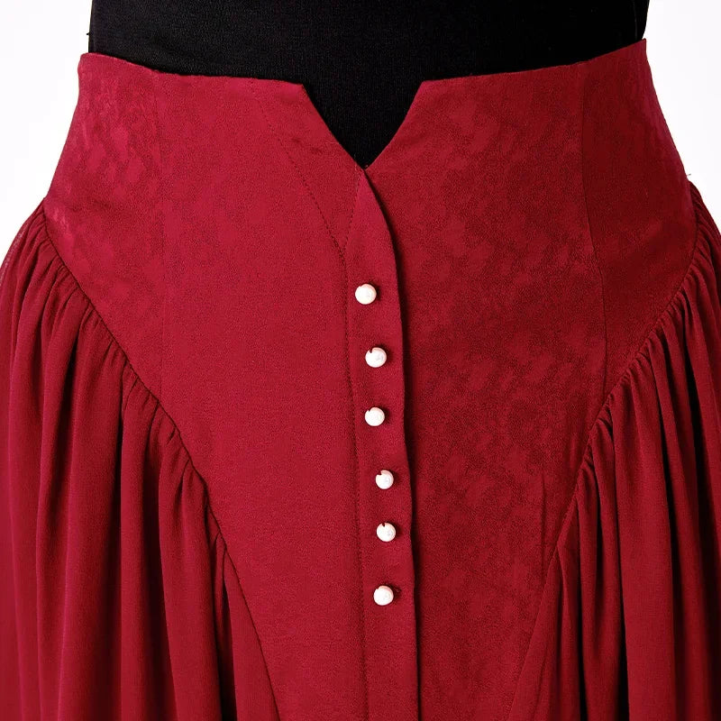 Detail view of the front waist section featuring a structured jacquard foundation and a decorative buttoned placket — From Borcelleclothes.