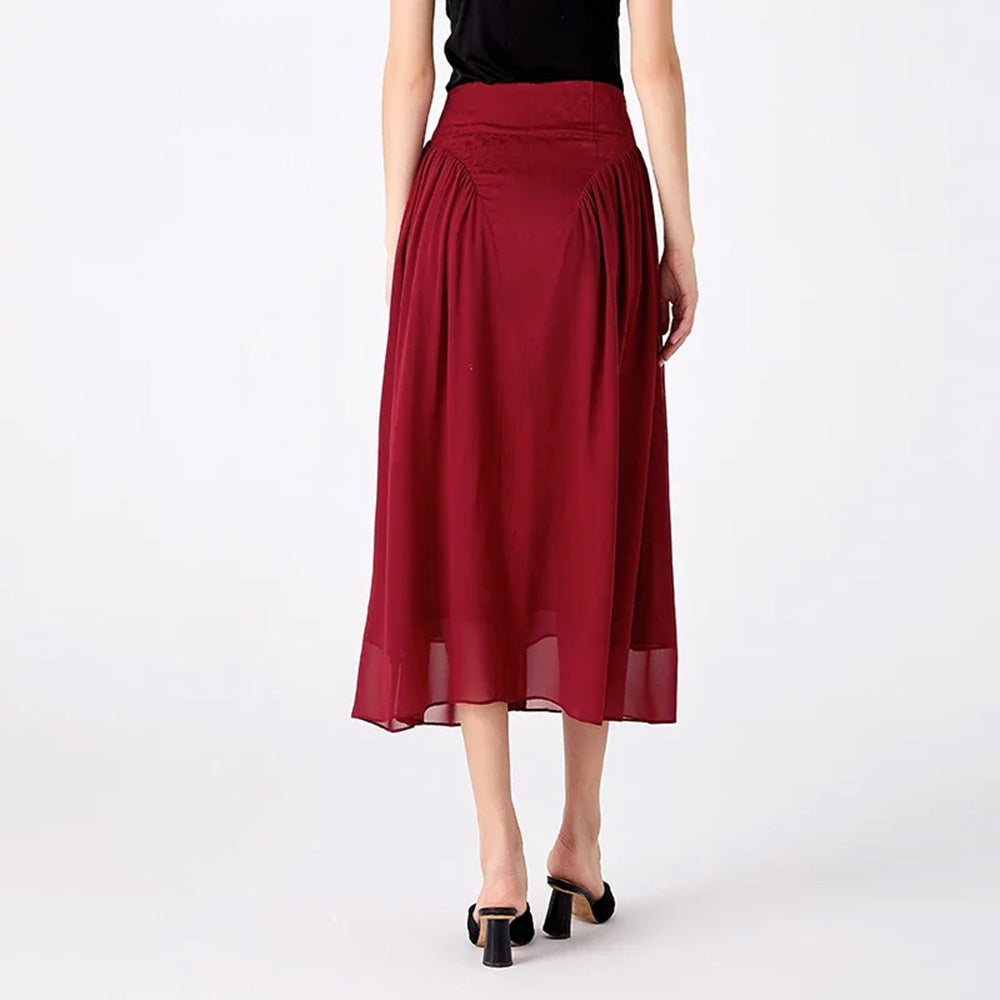 Rear view of a model in motion wearing a midi-length Mulberry silk skirt with side georgette panels — From Borcelleclothes.