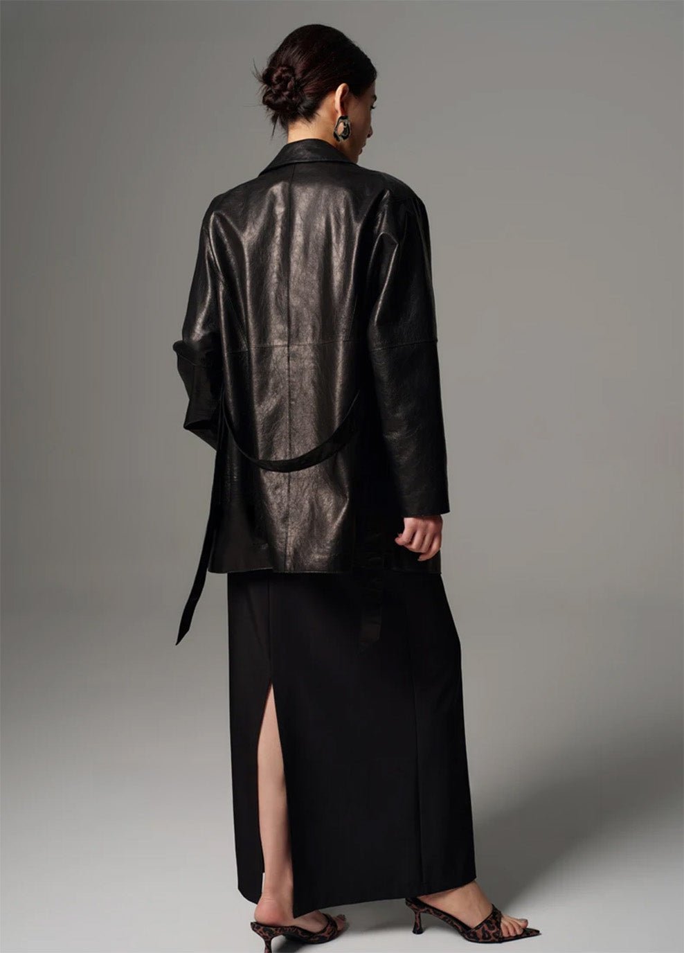 Back view of the glazed goatskin nappa wrap jacket showing clean shoulder lines and hip-length hem — From Borcelleclothes.