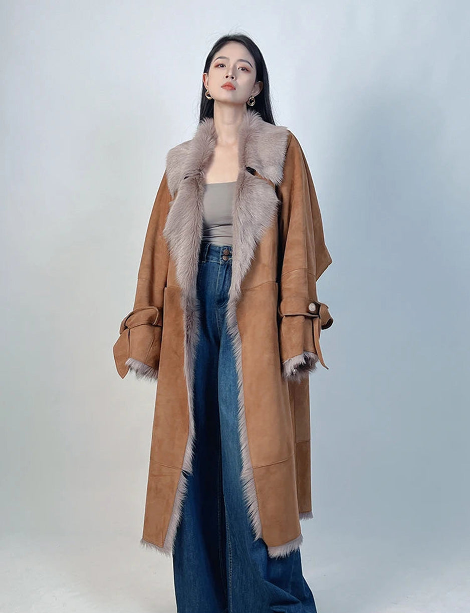 Women’s double-faced goatskin coat with self-tied cuffs and exposed wool trim, shown in Wolfin — From Borcelleclothes.