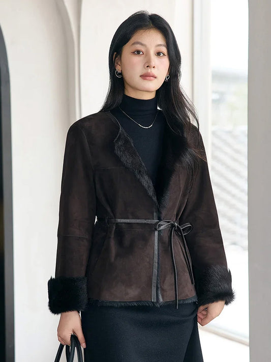 Model standing straight in the Tamarind goatskin jacket, showing the slim silhouette and leather-bound edges — From Borcelleclothes.