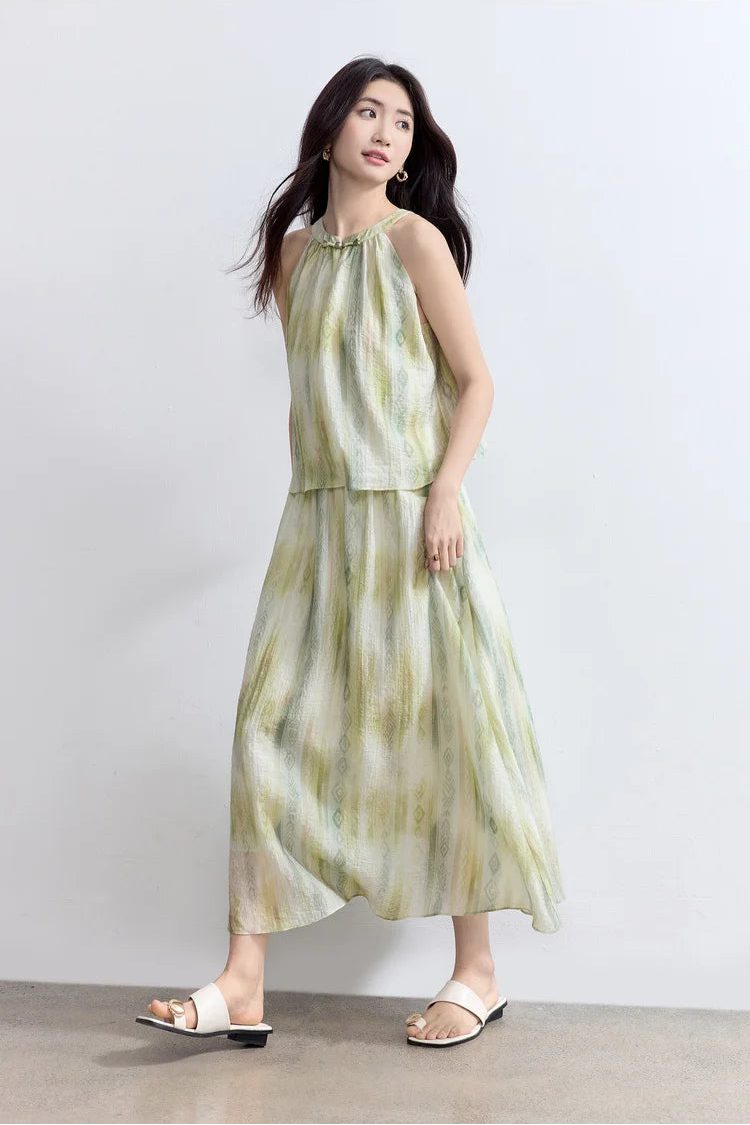 A woman captured in motion, showcasing the lightweight and breathable nature of the crinkled lyocell-nylon blend — From Borcelleclothes.