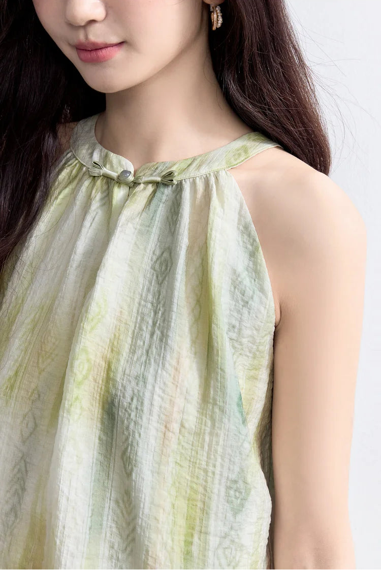 Close-up of the upper bodice, showing the high-neck construction and the delicate gathering of the lyocell fabric — From Borcelleclothes.