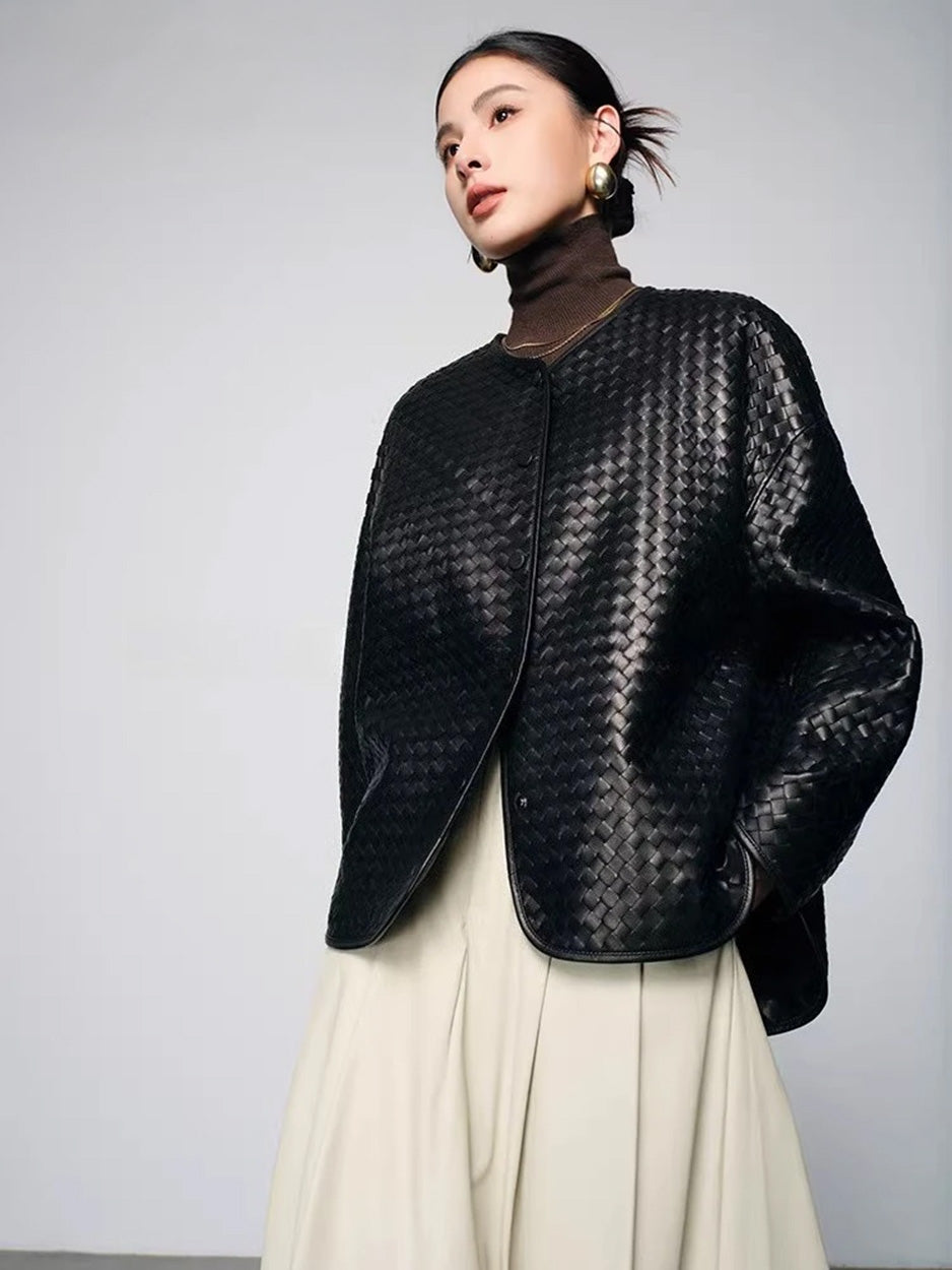 Three-quarter profile of model highlighting diagonal geometric leather weaving — From Borcelleclothes.