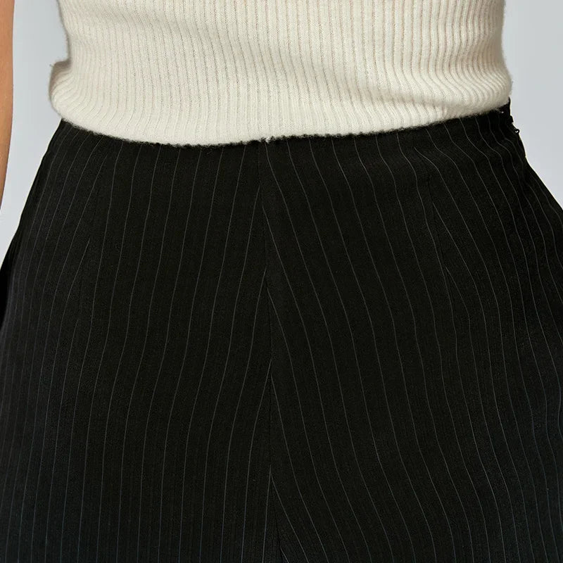 Back waist section and seamless inner yoke design of women's pinstripe silk trousers — From Borcelleclothes.