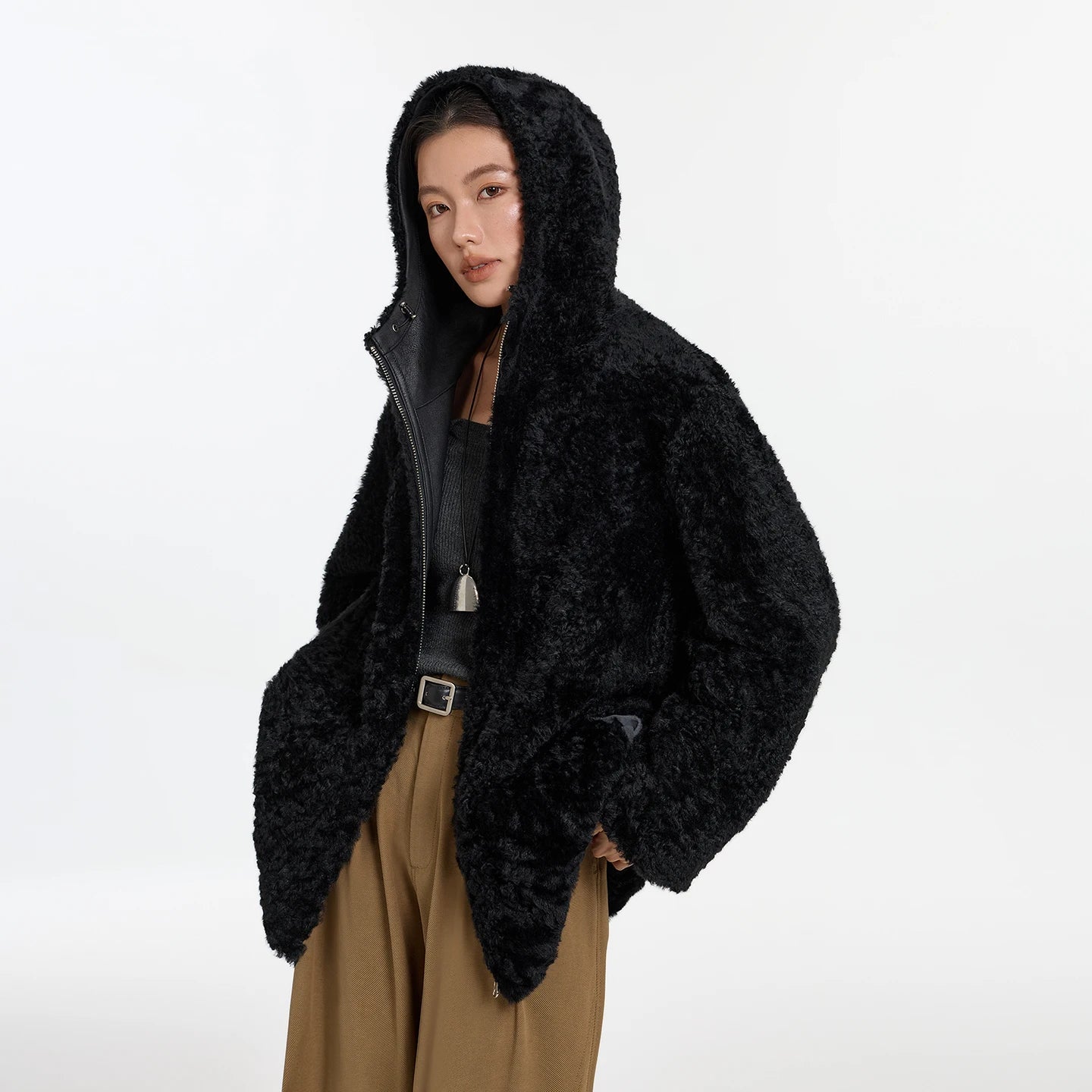 Women's reversible shearling coat with hood, crafted from Lacaune lamb, featuring the short coiled texture, shown in Night Swirling — From Borcelleclothes.
