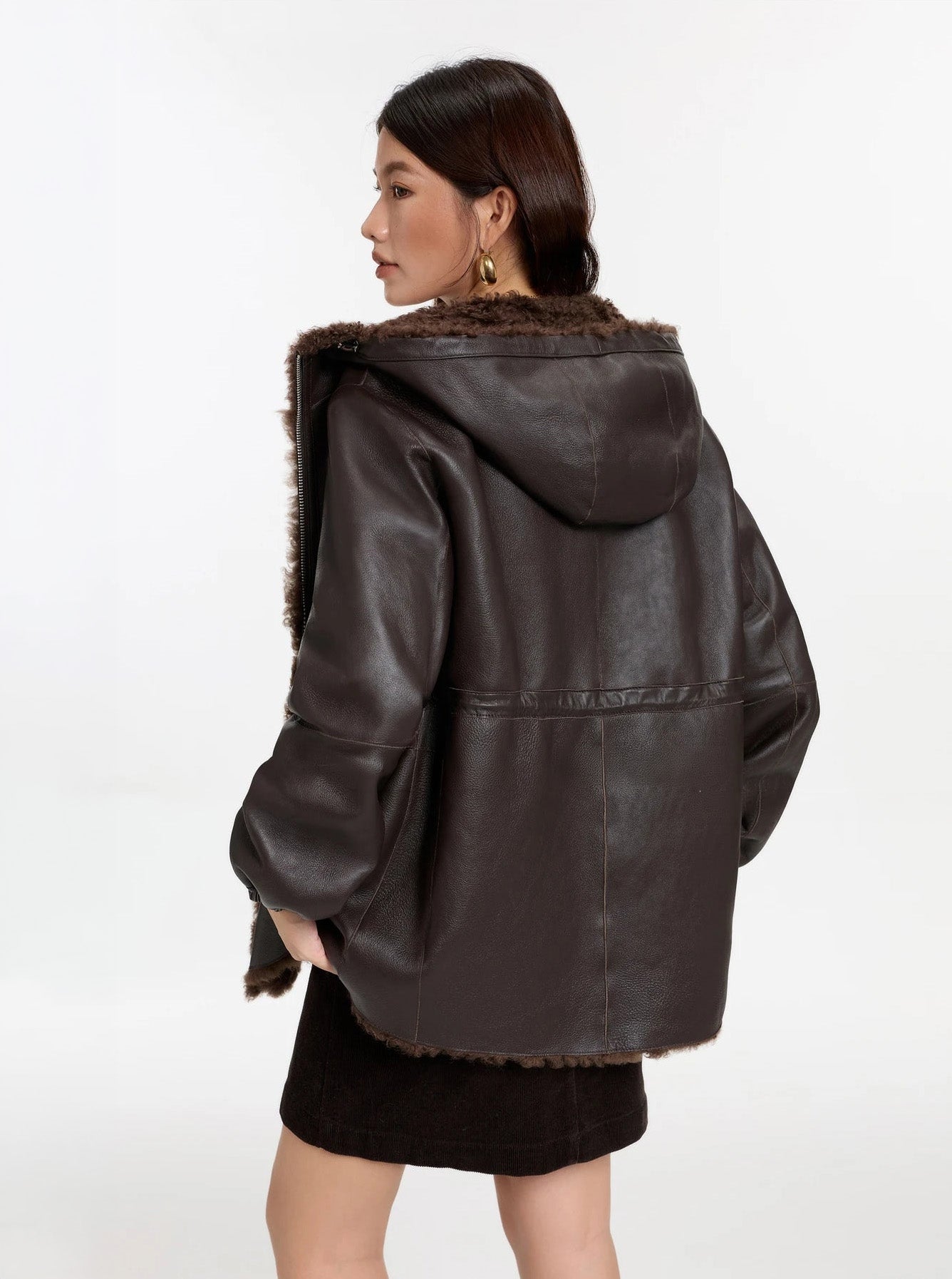 Model facing back, Toffee Bloom coat, leather side — From Borcelleclothes.