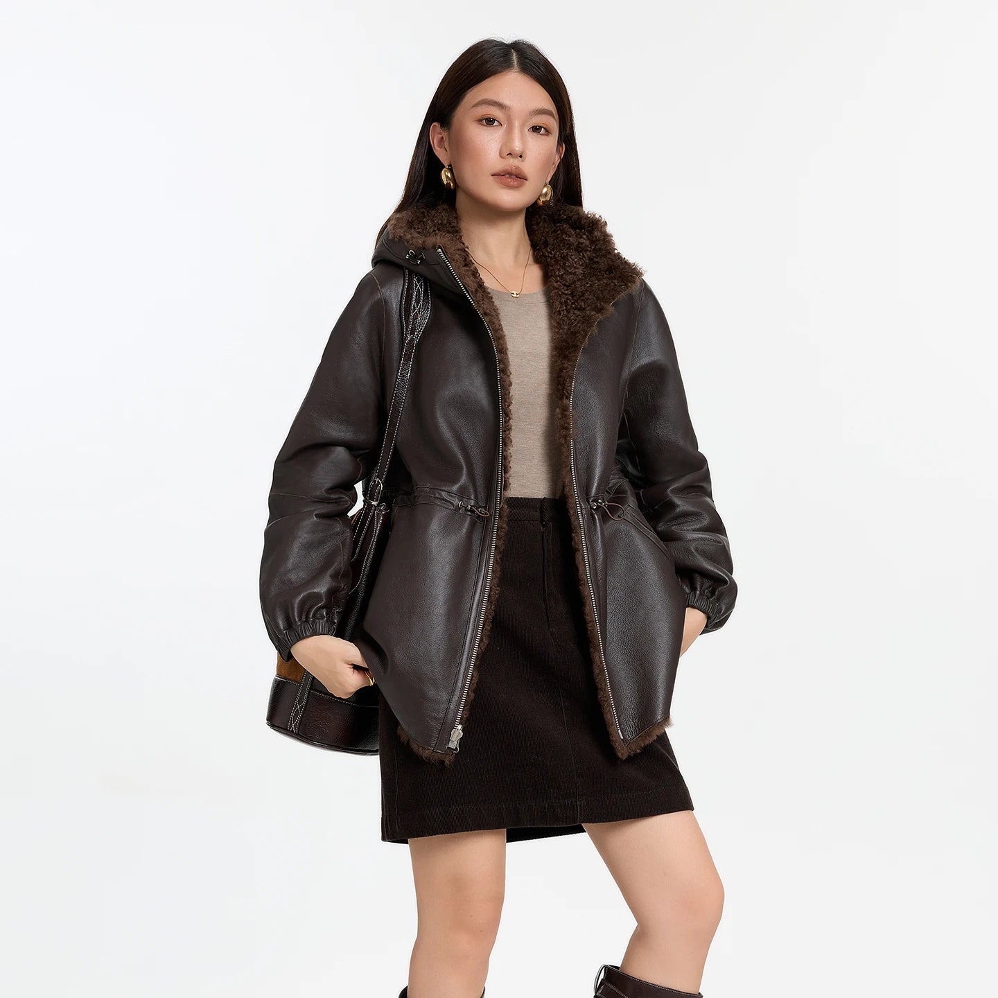 Women's reversible shearling coat with hood, crafted from Lacaune lamb, featuring the short coiled texture, shown in Toffee Bloom — From Borcelleclothes.