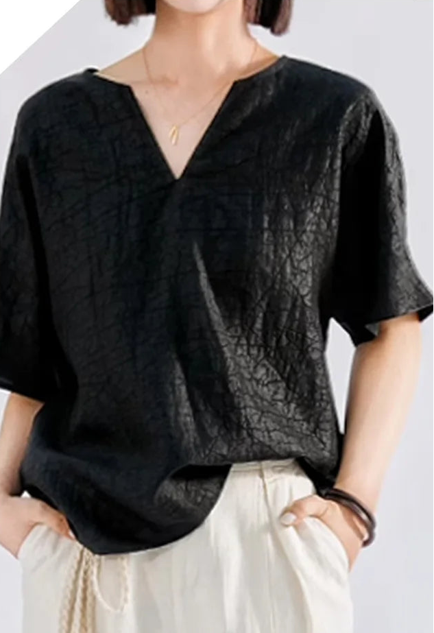Front view of the loose-fit Beyond Control silk top with 1/2 kimono sleeves and notched neckline, styled with hands in pockets — From Borcelleclothes.