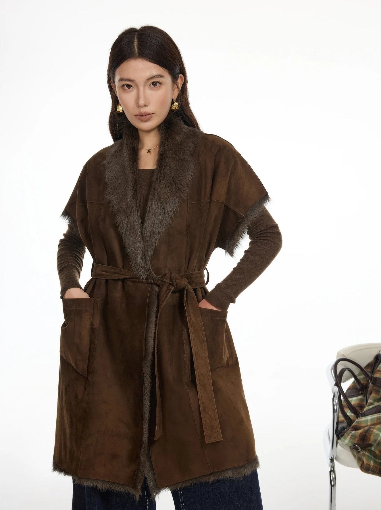 Model wearing Coffeehouse Chocolate goatskin jacket, hands placed in side patch pockets — From Borcelleclothes.