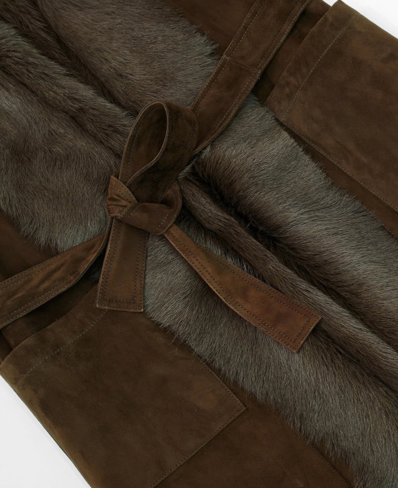Detail of self-tie belt fastened around Coffeehouse Chocolate goatskin jacket — From Borcelleclothes.