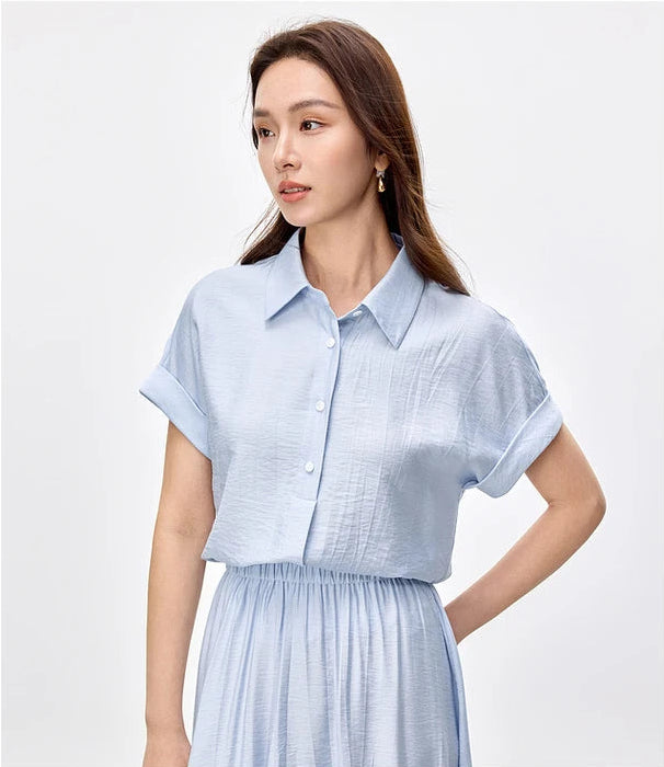 Soft profile of the Forget-Me-Not Mist ensemble, capturing the effortless grace of the woman — From Borcelleclothes.