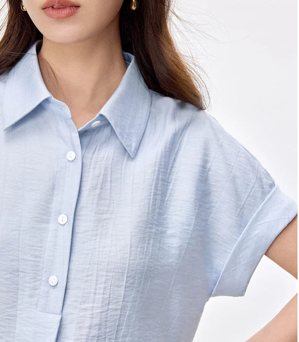 Detailed view of the pointed collar and single-breasted shirt in Forget-Me-Not Mist — From Borcelleclothes.