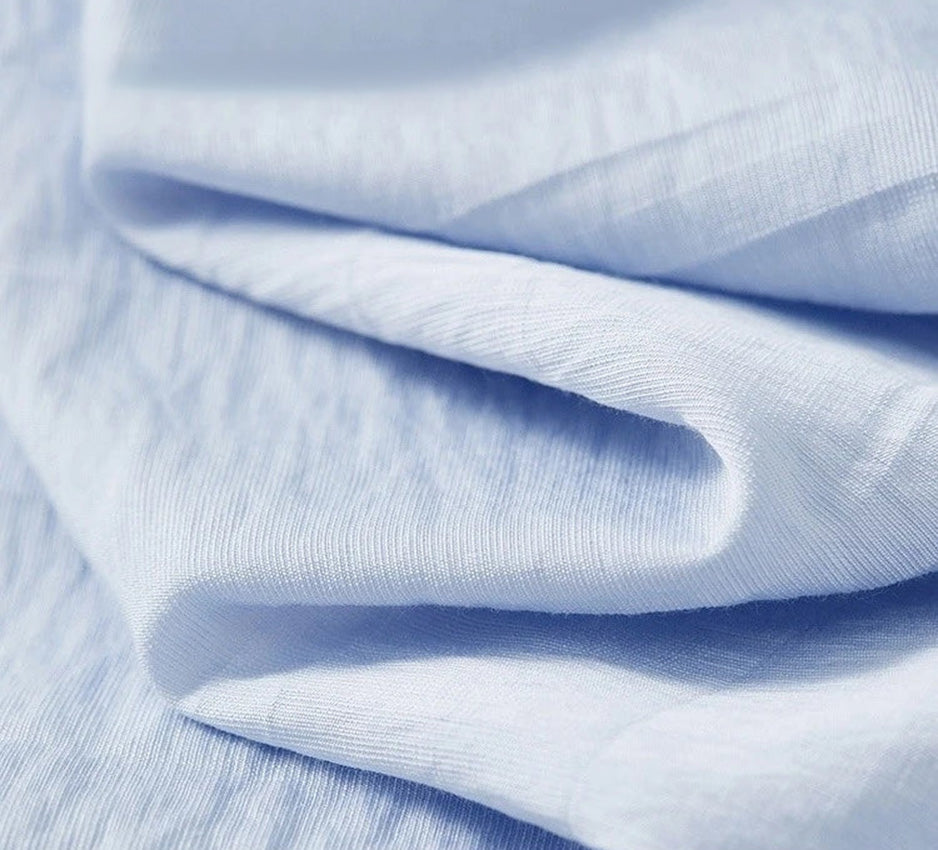Close-up of the crinkled texture of Forget-Me-Not Mist botanical viscose — From Borcelleclothes.