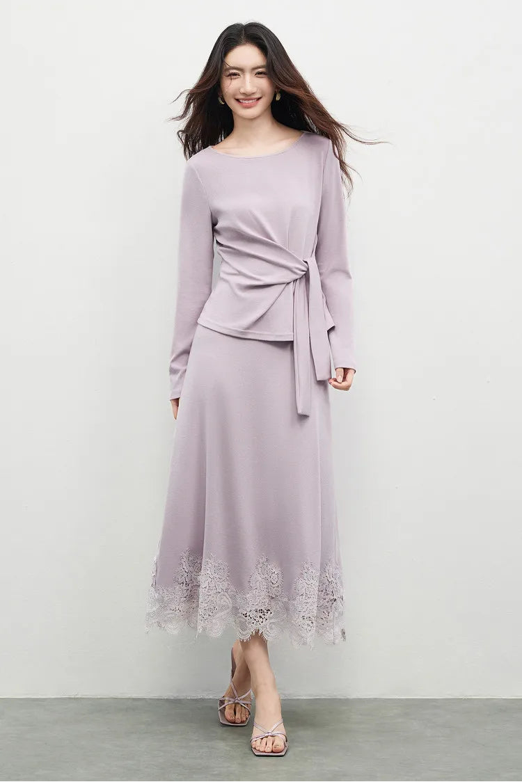 A woman walking forward in a flared midi skirt, showing the movement of the fabric and the Almost There tone. — From Borcelleclothes.
