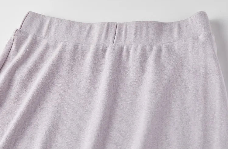Close-up of the elasticated waistband on the flared knit skirt in Almost There color. — From Borcelleclothes.