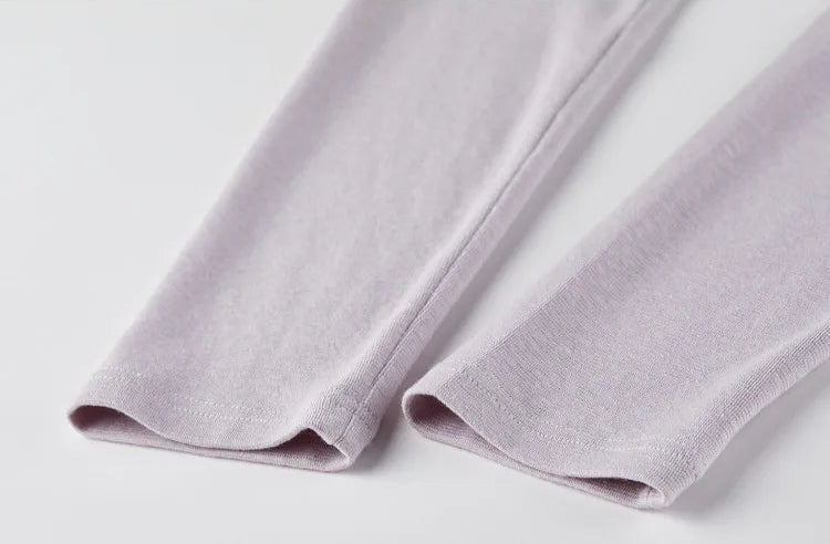 Details of the finished sleeve cuffs on the long-sleeve knit top. — From Borcelleclothes.