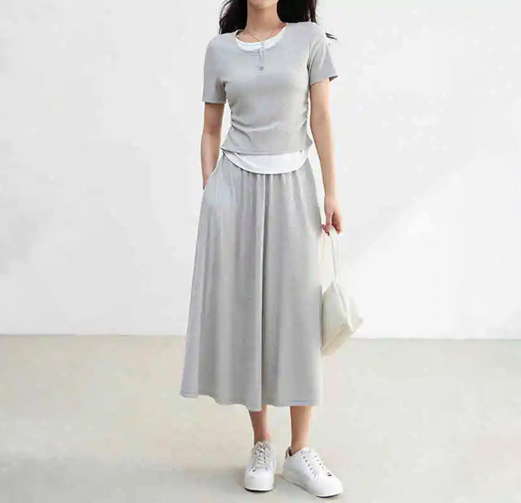 Women's ribbed knit coordinates in Incognito color, featuring a slim-fit buttoned top with white contrast inserts and a matching flared midi skirt. — From Borcelleclothes.