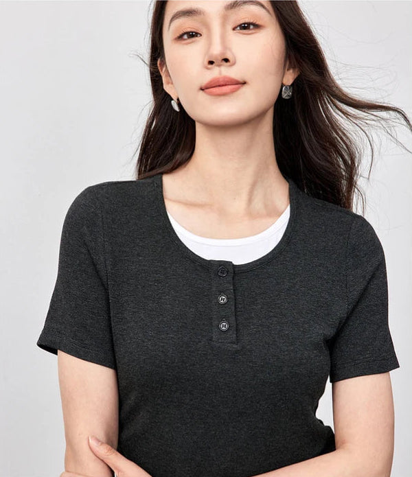 Close-up of a woman’s torso wearing the Mojo slim-fit ribbed top with gathered waist details — From Borcelleclothes.