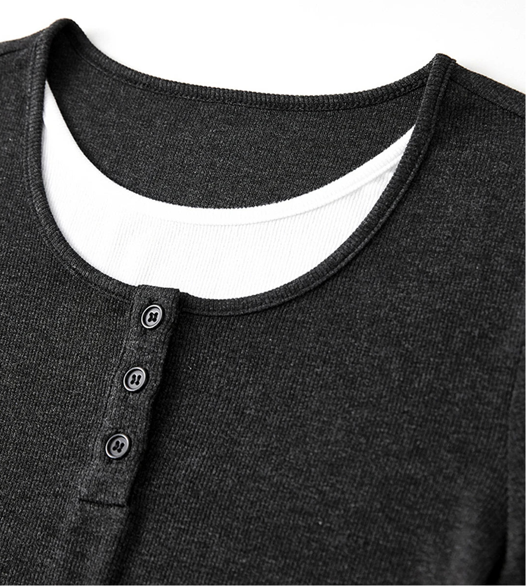 Close-up of the Mojo top neckline featuring white contrast layered inserts and button placket — From Borcelleclothes.