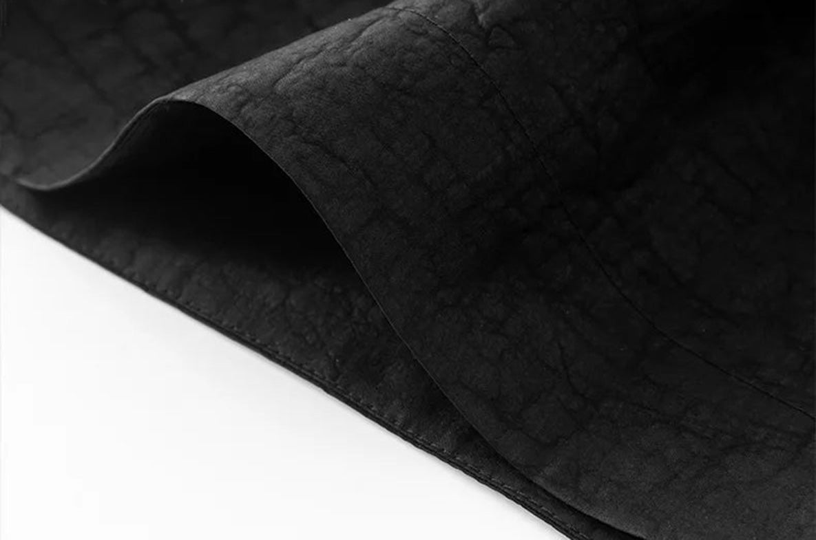 Detail view of the bottom hem on black Xiangyunsha Mulberry silk lantern pants in Tortoise Ticket — From Borcelleclothes.