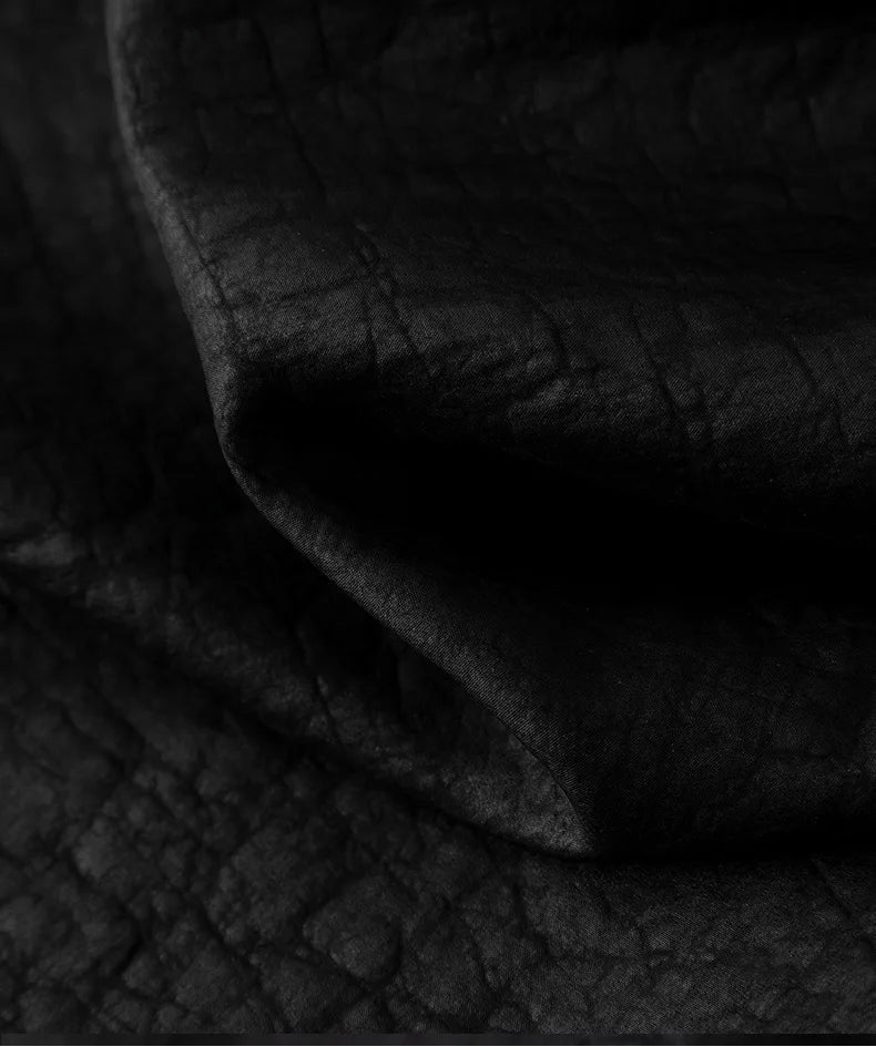 Close-up of wave-folded texture on black Xiangyunsha Mulberry silk lantern pants in Tortoise Ticket — From Borcelleclothes.