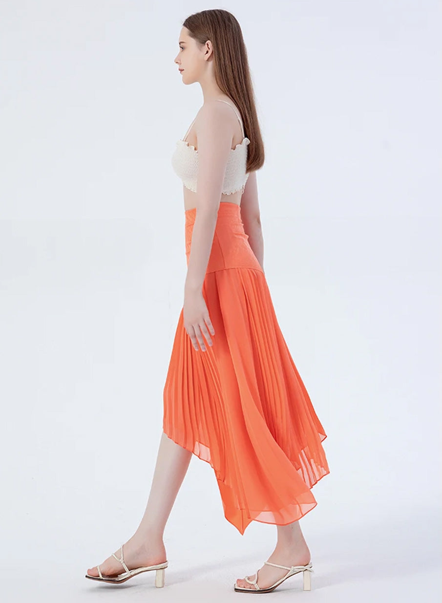 Side profile of a model walking in a women's layered asymmetrical Mulberry silk skirt in Veiltail Gold — From Borcelleclothes.