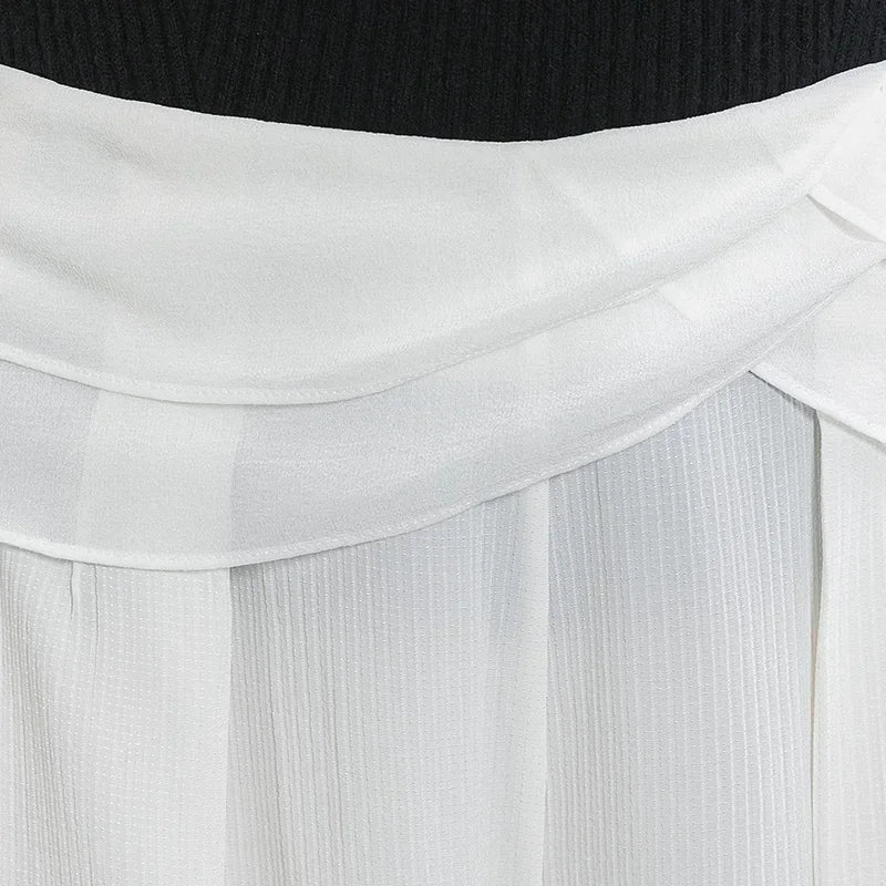 Detailed back view of the layered Georgette waist overlays and matching pleats on No Reward trousers — From Borcelleclothes