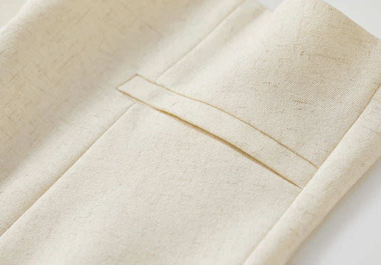 Macro shot of the welt pocket detail on the tailored linen blend vest. From Borcelleclothes.