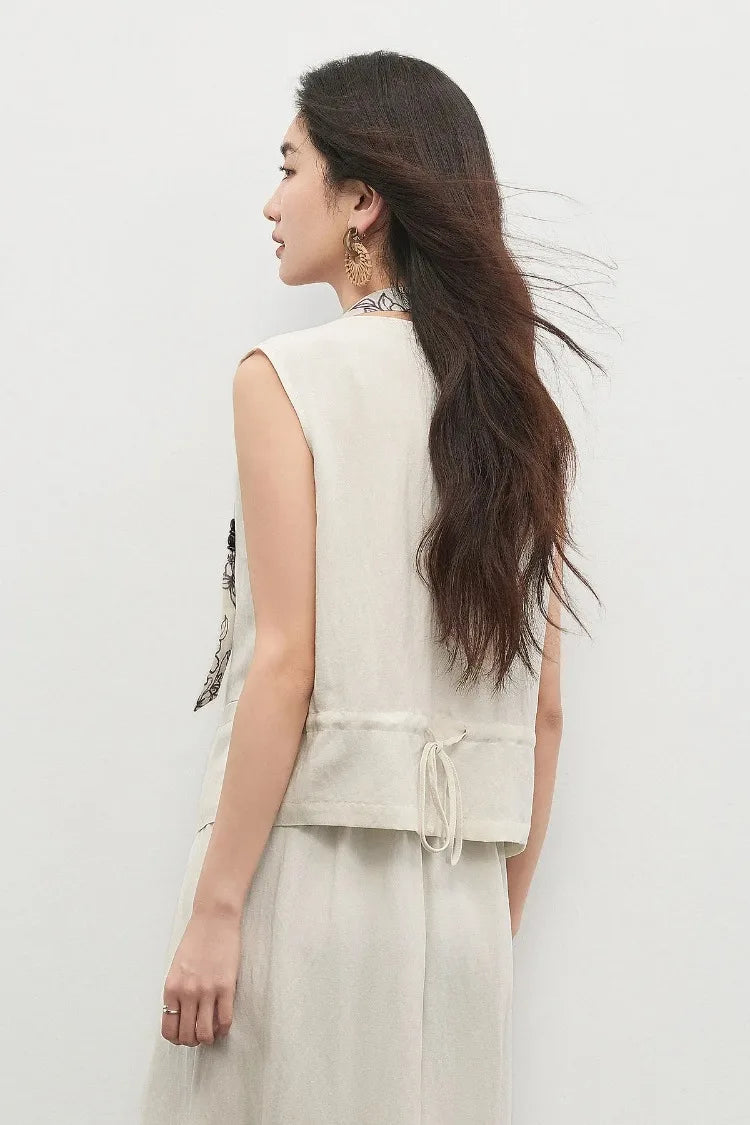The clean lines of the vest’s back, showing the adjustable drawstring casing — From Borcelleclothes.