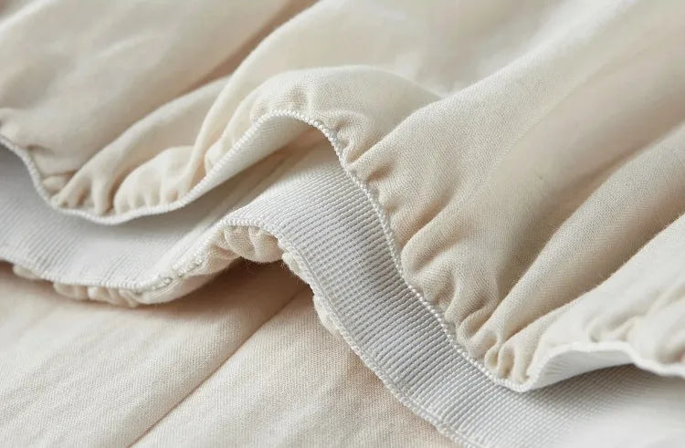 Inside view of the comfortable elasticated waistband of the pleated skirt — From Borcelleclothes.