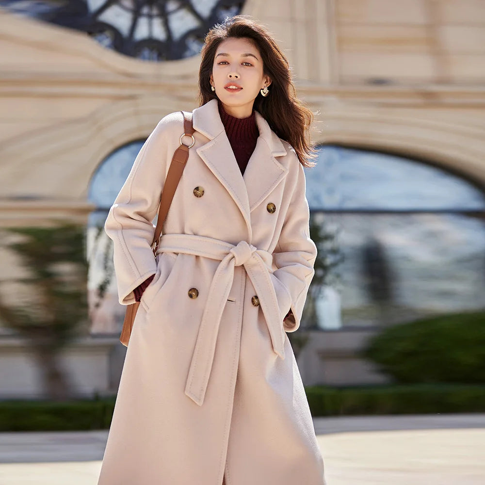 Women's mid-calf 100% lambswool coat in Blossom Dust, featuring a double-breasted design with tortoise-shell buttons and structured sleeve panels. — From Borcelleclothes.