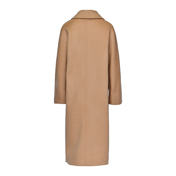 The architectural back view of the mid-calf lambswool coat in French Beige. From Borcelleclothes.